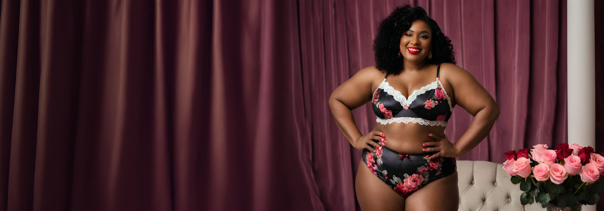 Plus-size model in a black floral-print bra and high-waist panty set with white lace trim